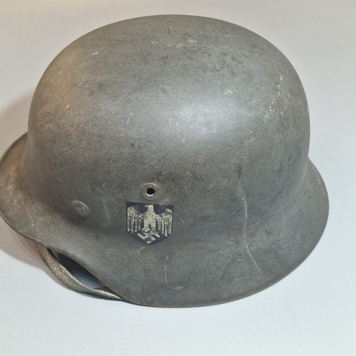 302 - German Third Reich M42 single decal helmet, with leather liner and chinstrap. Unclear markings stamp... 