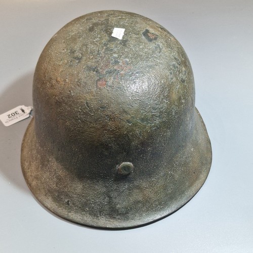 302 - German Third Reich M42 single decal helmet, with leather liner and chinstrap. Unclear markings stamp... 