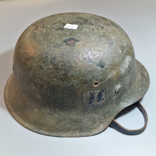 302 - German Third Reich M42 single decal helmet, with leather liner and chinstrap. Unclear markings stamp... 