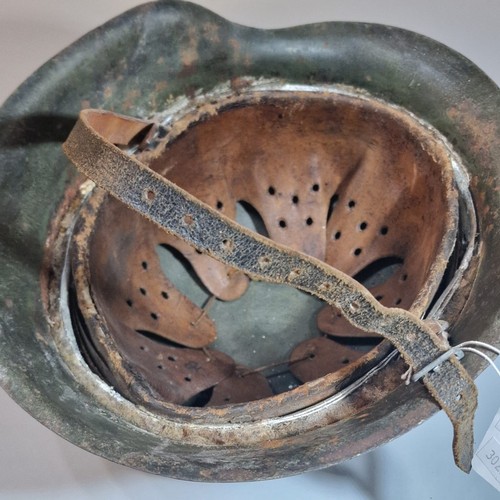 302 - German Third Reich M42 single decal helmet, with leather liner and chinstrap. Unclear markings stamp... 