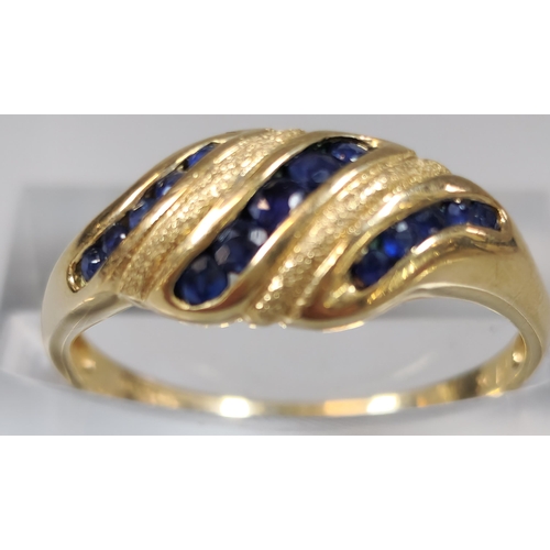 221 - 9ct gold blue stone banded dress ring. 2.4g approx. Size O.  (B.P. 21% + VAT)