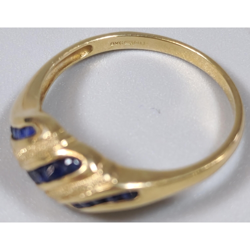 221 - 9ct gold blue stone banded dress ring. 2.4g approx. Size O.  (B.P. 21% + VAT)