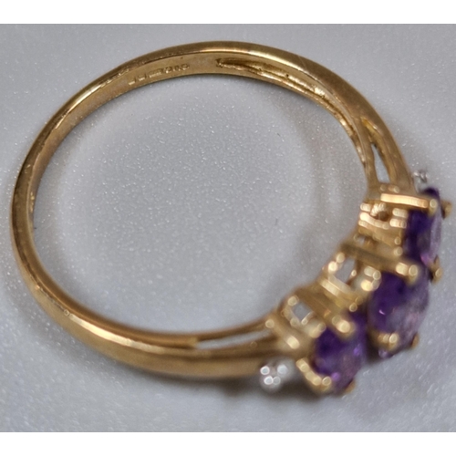 231 - 9ct gold purple stone dress ring. 1.6g approx. Size O1/2.  (B.P. 21% + VAT)