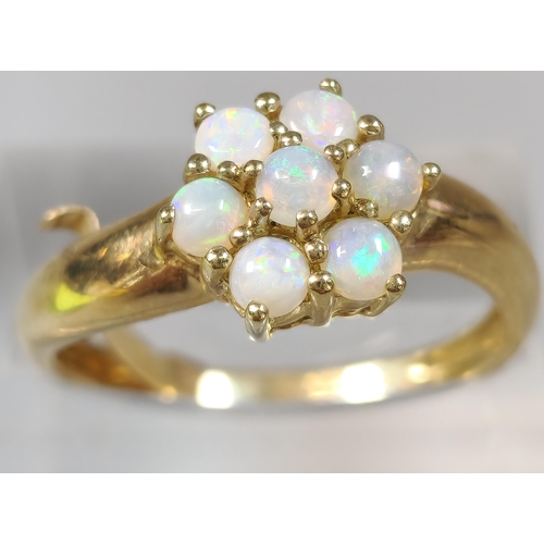 236 - 9ct gold and opal multi-cluster flowerhead ring. 2.6g approx. Size O1/2.  (B.P. 21% + VAT)