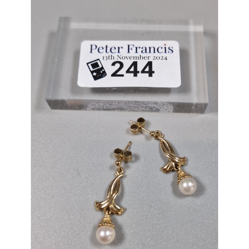 244 - Pair of 9ct gold and pearl earrings. Total weight 2.7g approx.  (B.P. 21% + VAT)