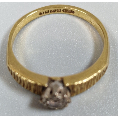 251 - 18ct gold diamond solitaire ring with bark design shoulders. 4.1g approx. Size M1/2. (B.P. 21% + VAT... 