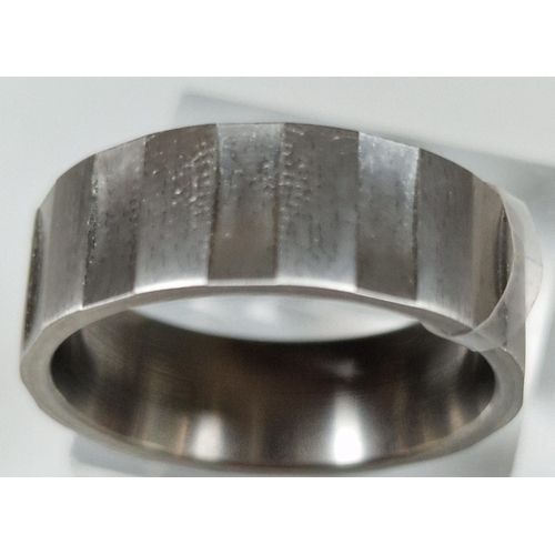 254 - Modernist design titanium ring. Size T1/2. (B.P. 21% + VAT)