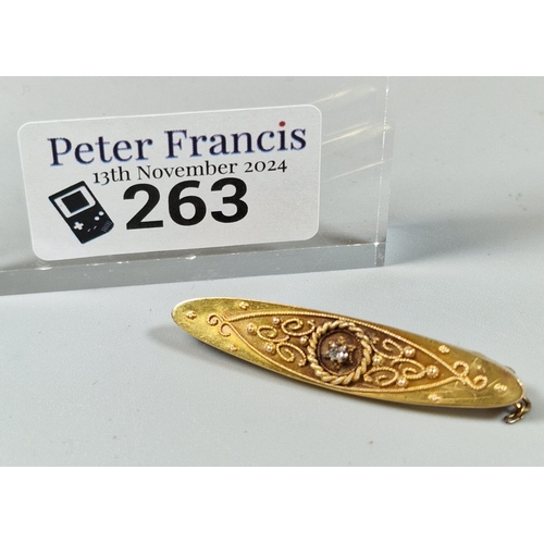 263 - Early 20th century 15ct gold bar brooch of oval form inset with tiny diamond chip. 2.8g approx. (B.P... 