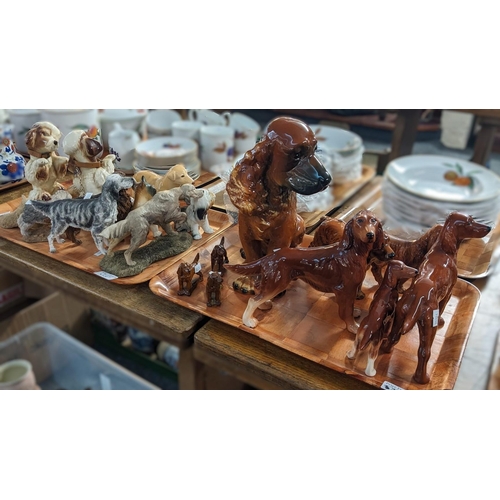 358 - Two trays of china and other composition studies of dogs to include: Red Setters by Wade, Goebel Wes... 