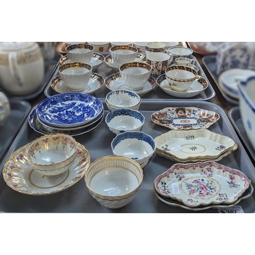 387 - Two trays of assorted tea bowls and saucers, many 18th century Worcester: two Worcester teacups, ass... 