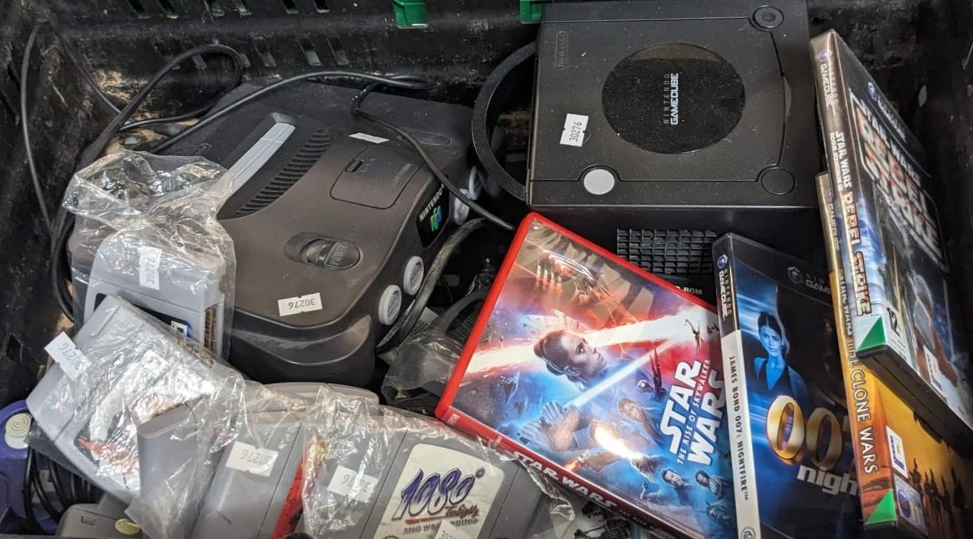Box containing Nintendo 64 and Nintendo Game Cube, with games and ...