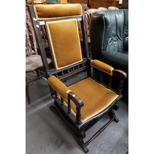 514 - Early 20th century American upholstered rocking chair on sprung under-frame.  (B.P. 21% + VAT)