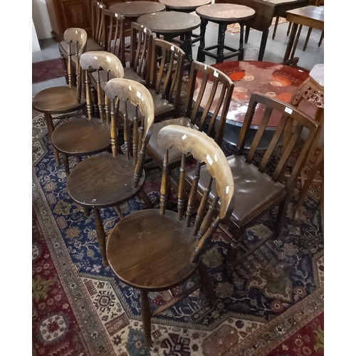 519 - Set of four early 20th century beech and elm kitchen chairs, with turned stick backs on circular sea... 