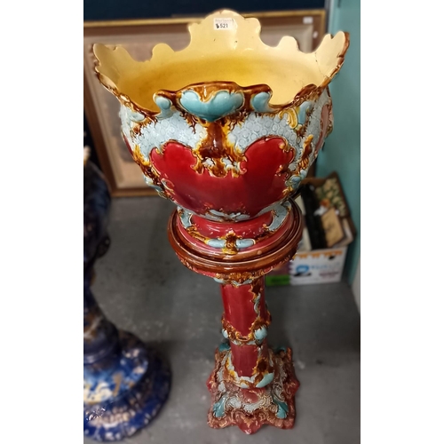 521 - Art Nouveau Majolica ruby and turquoise ground jardinière on stand. 130cm high approx.  (B.P. 21% + ... 