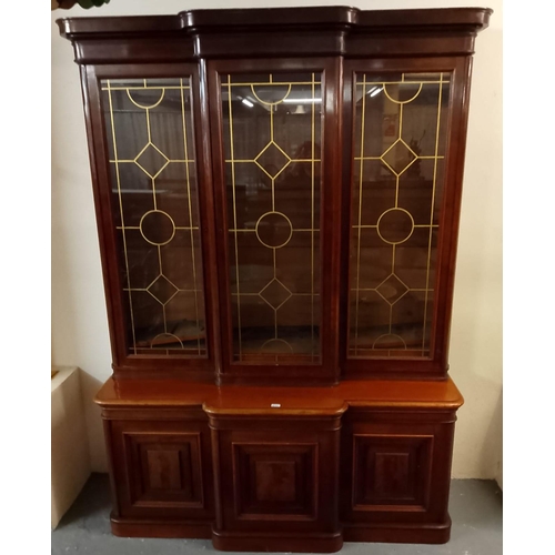 523 - Victorian mahogany break front library bookcase, having moulded cornice above three glazed doors wit... 