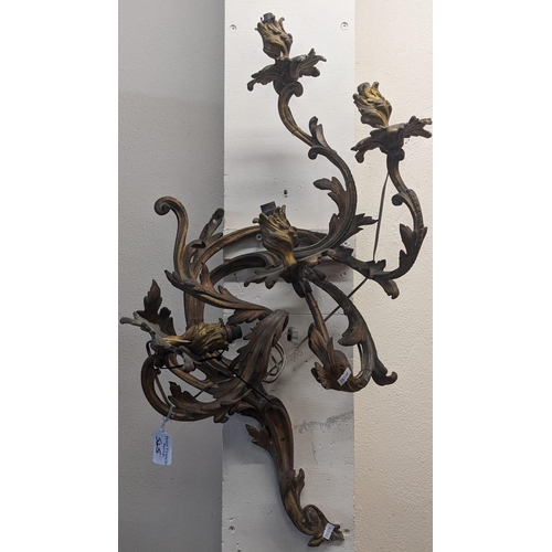 525 - Pair of ormolu rococo style four branch wall lights. (2)  (B.P. 21% + VAT)