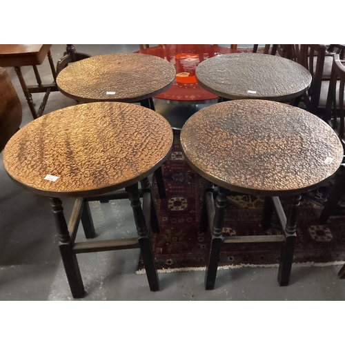 527 - Matching set of four matching beaten copper topped pub type tables. (4)  (B.P. 21% + VAT)