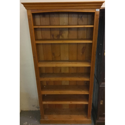 533 - Modern natural pine open bookcase in Georgian style with moulded cornice over adjustable shelves on ... 