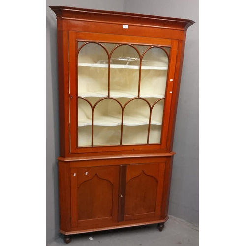 549 - Late Victorian Welsh mahogany double standing corner cupboard, having moulded cornice over single gl... 