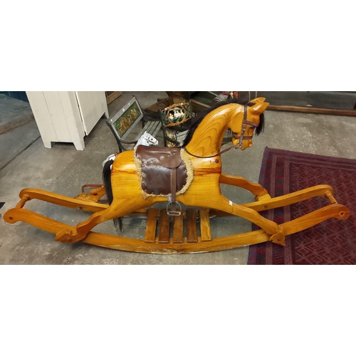 552 - 20th century natural pine carousel type large rocking horse with natural mane and tail, leather sadd... 