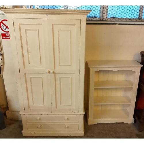 563 - Painted pine wardrobe with moulded cornice over two panelled doors with two drawers below. 102x58x19... 