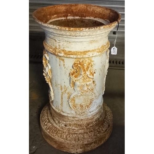 572 - Cast iron cylindrical garden pedestal/planter with relief mask decoration on acanthus leaf base. 50 ... 