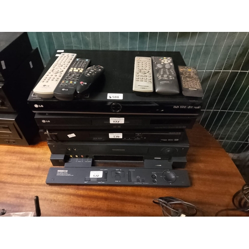 588 - Collection of DVD players and a VHS player to include: LG, Pioneer, Thomson etc. With a collection o... 