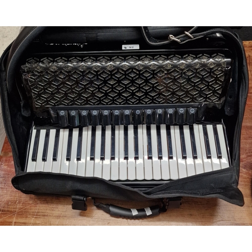 92 - Modern 'Startone' Accordion in fitted case with a variety of accordion music books.  (B.P. 21% + VAT... 