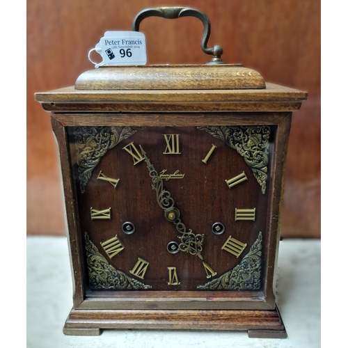 96 - Junghans three train bracket style oak cased clock. (B.P. 21% + VAT)