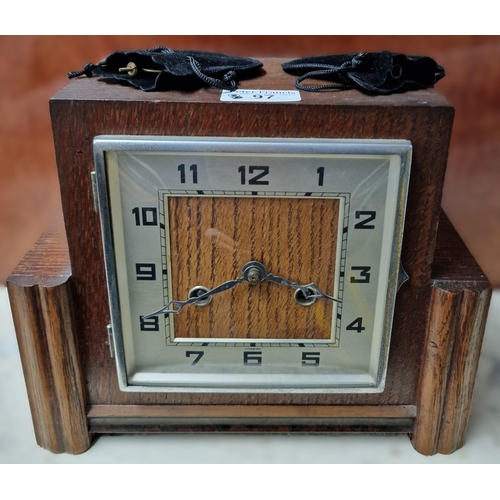 97 - Art Deco design oak framed two train mantel clock marked Foreign. With key and pendulum. (B.P. 21% +... 