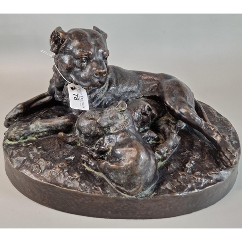 78 - After W. Wolfe, a bronzed study of a Bullmastiff and her two pups, on an oval naturalistic base. 34c... 