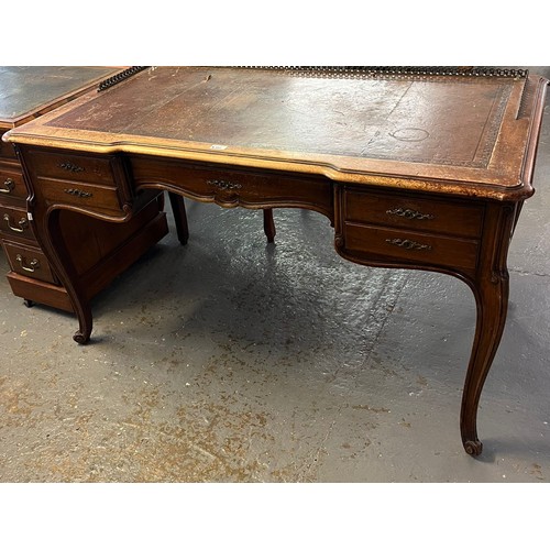 485 - Early 20th century French walnut writing table, having brass galleried top with inset leather writin... 