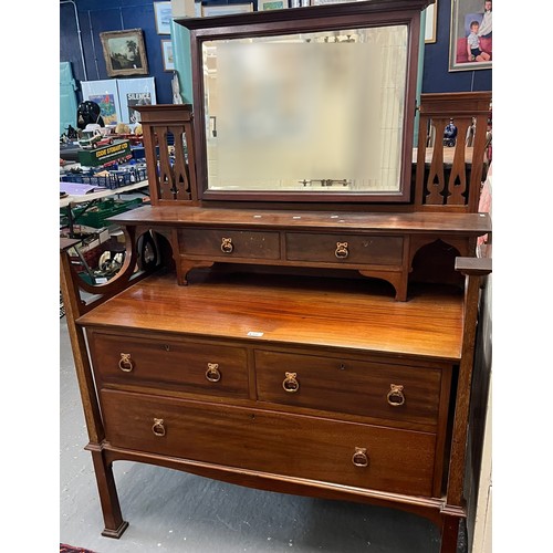 496 - Arts and Crafts design mahogany mirror back dressing table, with beveled plate and three drawers to ... 