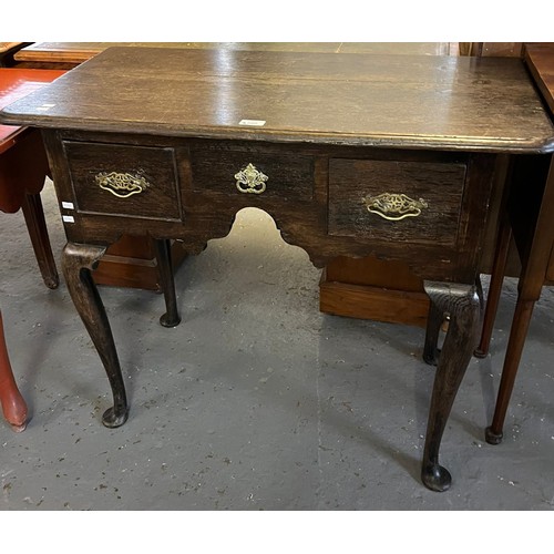 505 - 18th century oak lowboy, now having moulded edged top over three frieze drawers around an arched kne... 