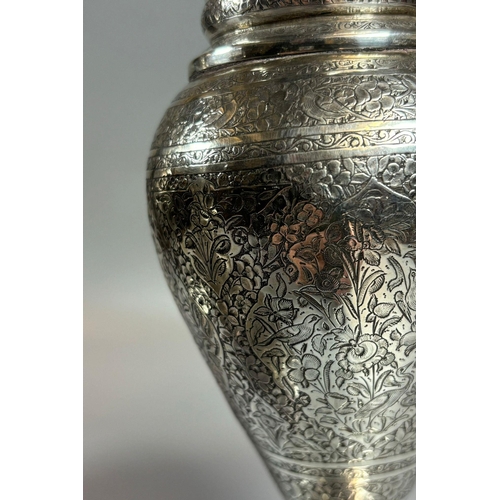 154 - Two similar pairs of white metal Persian design vases, ornately engraved with flowers and foliage. T... 