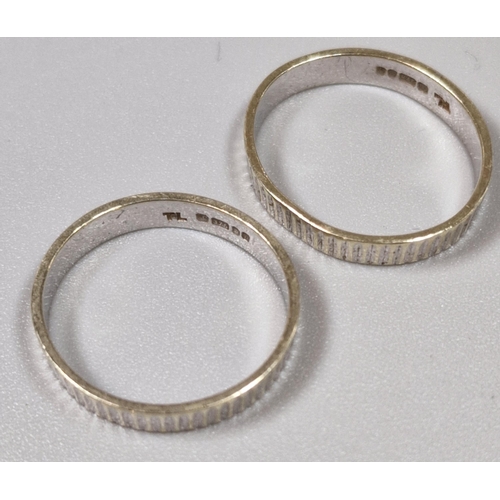 185 - Two 9ct white gold engraved wedding rings, hallmarked for London 1978. 4g approx. Size N and P. (B.P... 