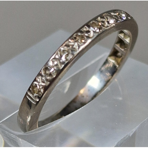 188 - 18ct white gold half eternity diamond ring, channel set with twelve diamonds. 3.6g approx. Size N. (... 