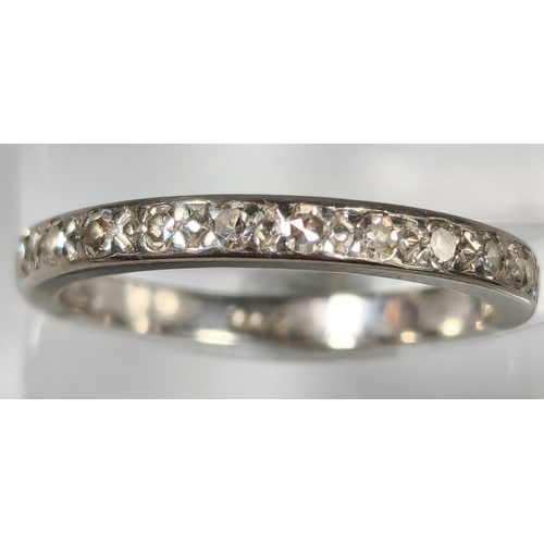 188 - 18ct white gold half eternity diamond ring, channel set with twelve diamonds. 3.6g approx. Size N. (... 