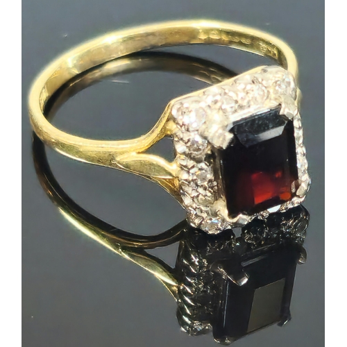 191 - 18ct gold red stone and diamond ring, the central rectangular faceted stone flanked tiny diamond chi... 