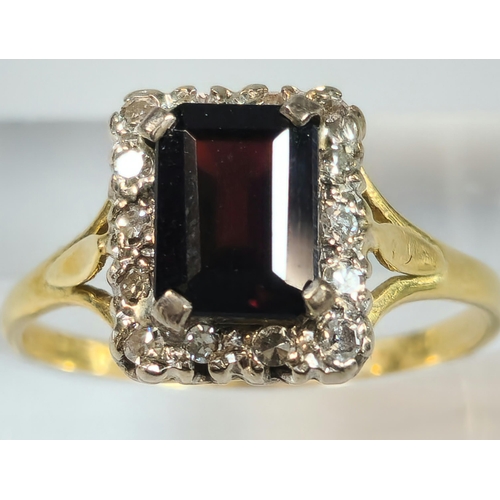 191 - 18ct gold red stone and diamond ring, the central rectangular faceted stone flanked tiny diamond chi... 