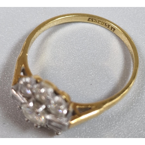 193 - 18ct gold and platinum diamond flowerhead ring, having seven brilliant round cut diamonds and two ba... 