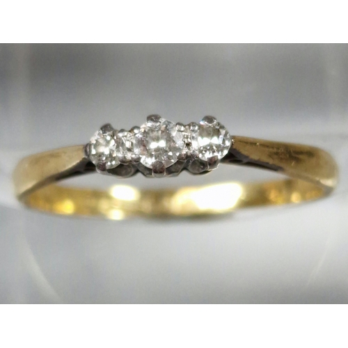 203 - 18ct gold and platinum diamond three stone ring. 2g approx. Size N1/2. (B.P. 21% + VAT)