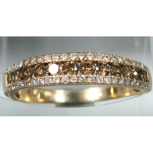 206 - Yellow metal chocolate and clear diamond half eternity ring. 2.2g approx. Size Q. (B.P. 21% + VAT)