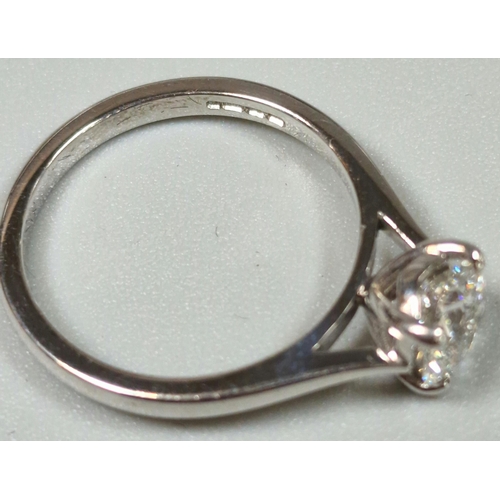 212 - 18ct white gold round brilliant cut diamond solitaire ring, measuring 1.25 carats approx, in a four ... 