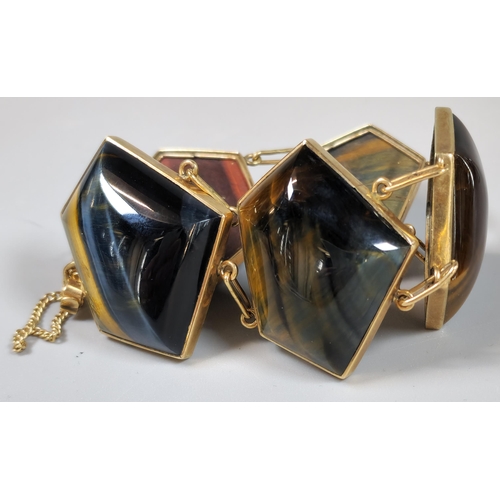 227 - 9ct gold, Labradorite and Tiger's Eye five stone bracelet, of geometric form. Total weight 62.7g app... 