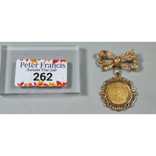 262 - Late Victorian gold half sovereign dated 1892, in ornate 9ct gold bow brooch mount. Weight 10.2g.  (... 