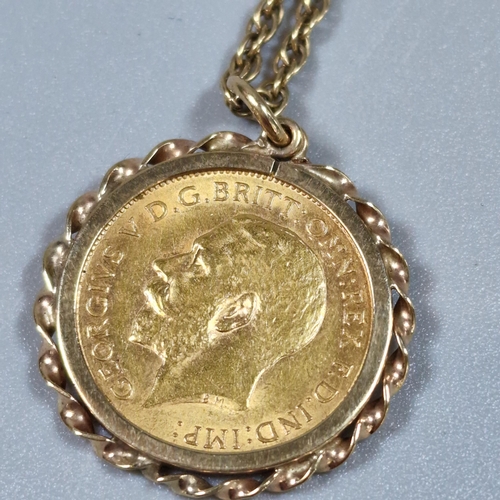 268 - George V gold half sovereign dated 1912, in 9ct gold ornate pendant mount on a 9ct gold rope twist c... 