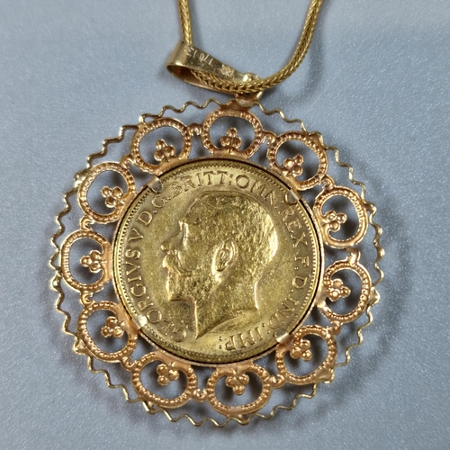 270 - George V gold full sovereign dated 1911, in ornate 9ct gold pendant on a fine link 9ct gold chain. 1... 