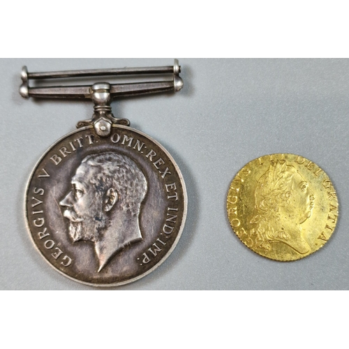 275 - George III gold spade Guinea dated 1798. 8.6g approx. Together with WWII 1914-1918 medal, the rim ma... 