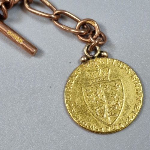 276 - George III gold spade Guinea dated 1791, on a 9ct rose gold curb-link T Bar Albert chain. 39.3g appr... 